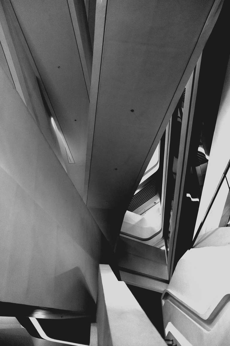 Black and white photography, picture of staircases inside a building of Hong Kong University.