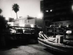 Black and white street photography, a picture of boats on land in Toulon, south of France.